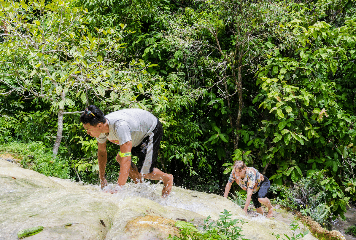 thailand bua tong unique waterfall with a height of 330 feet people climb without slipping