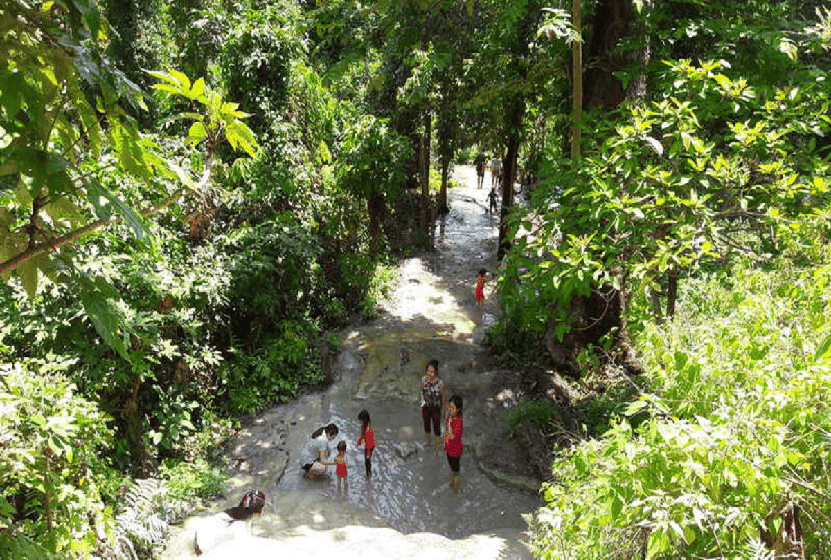 thailand bua tong unique waterfall with a height of 330 feet people climb without slipping