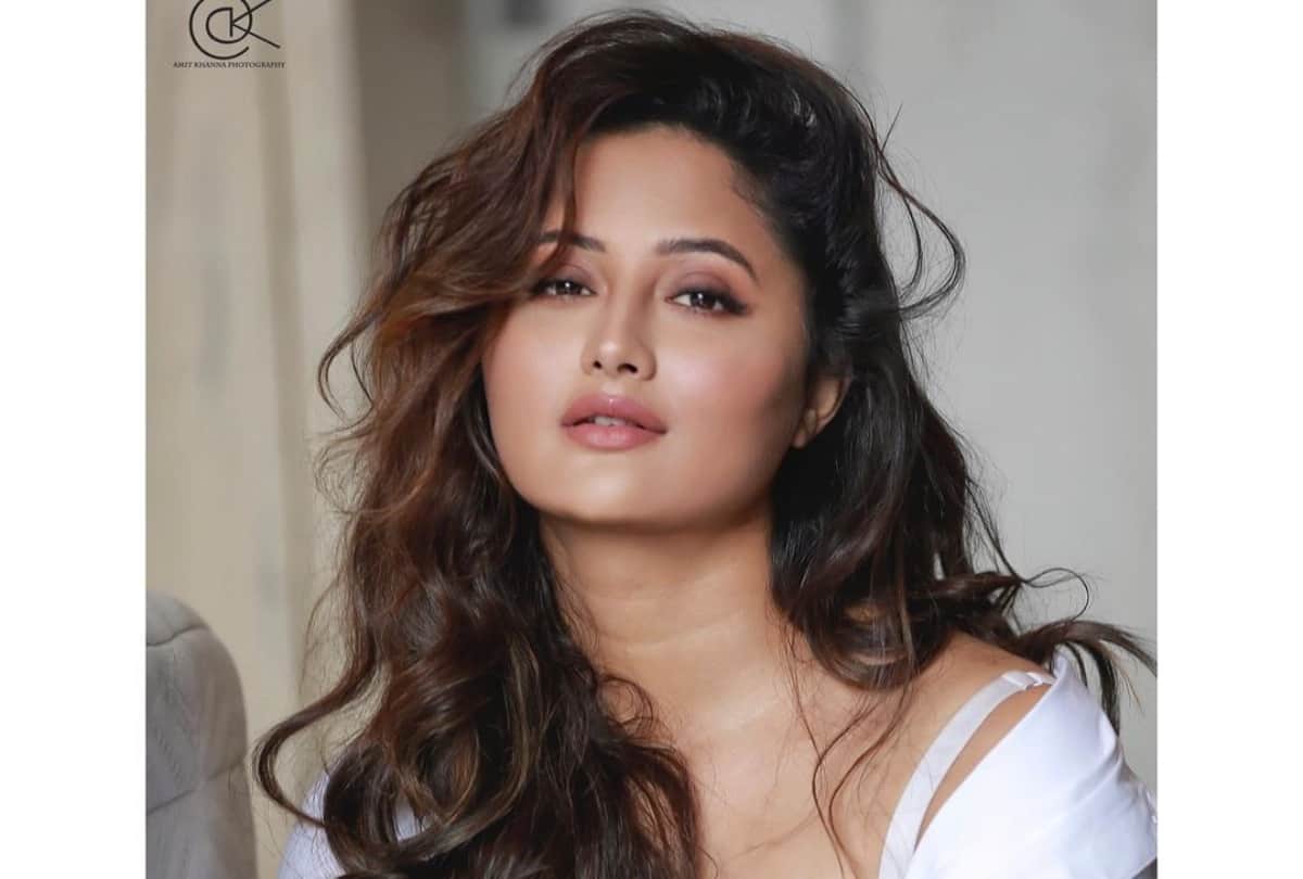 rashmi desai bold photoshoot in white shirt with matching bralette