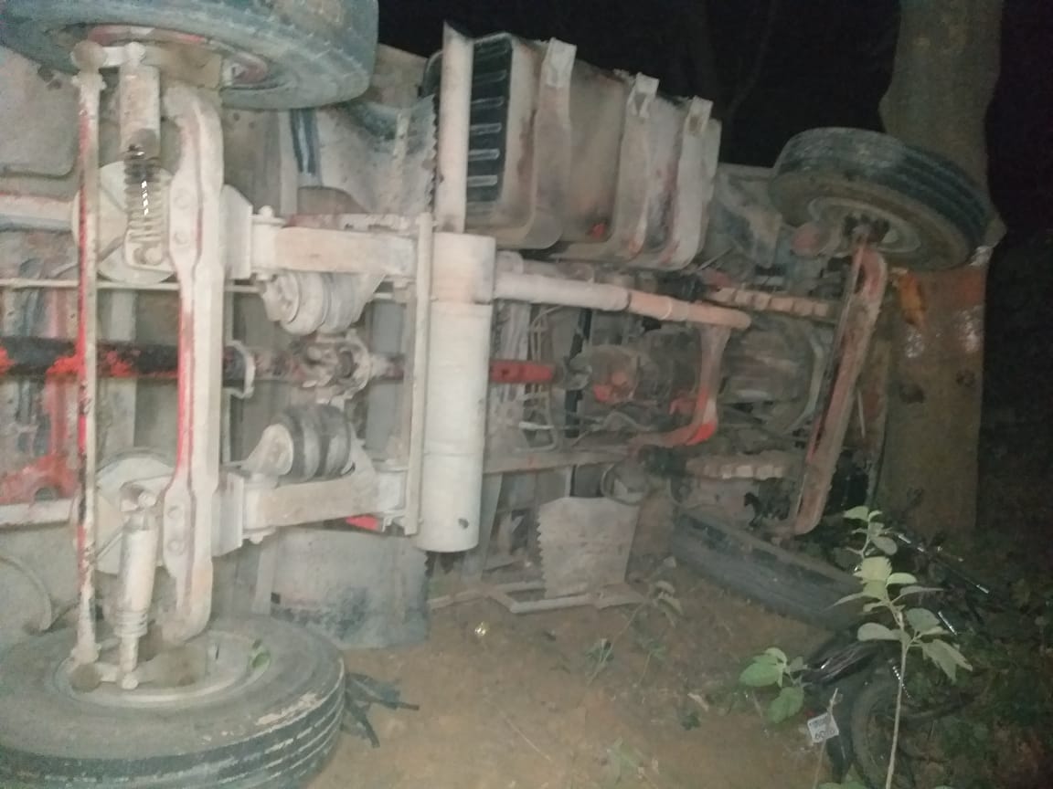 Truck laden with sugar overturns, two youths buried