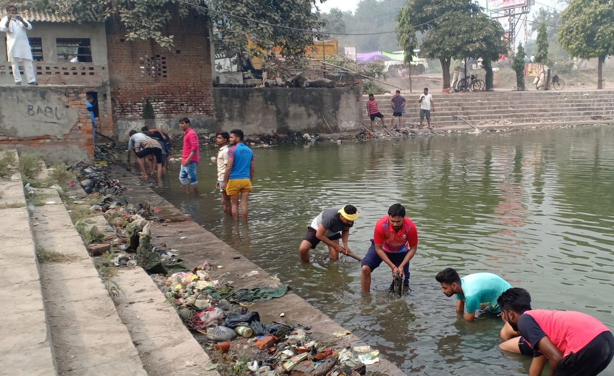 The youth cleaned the pond