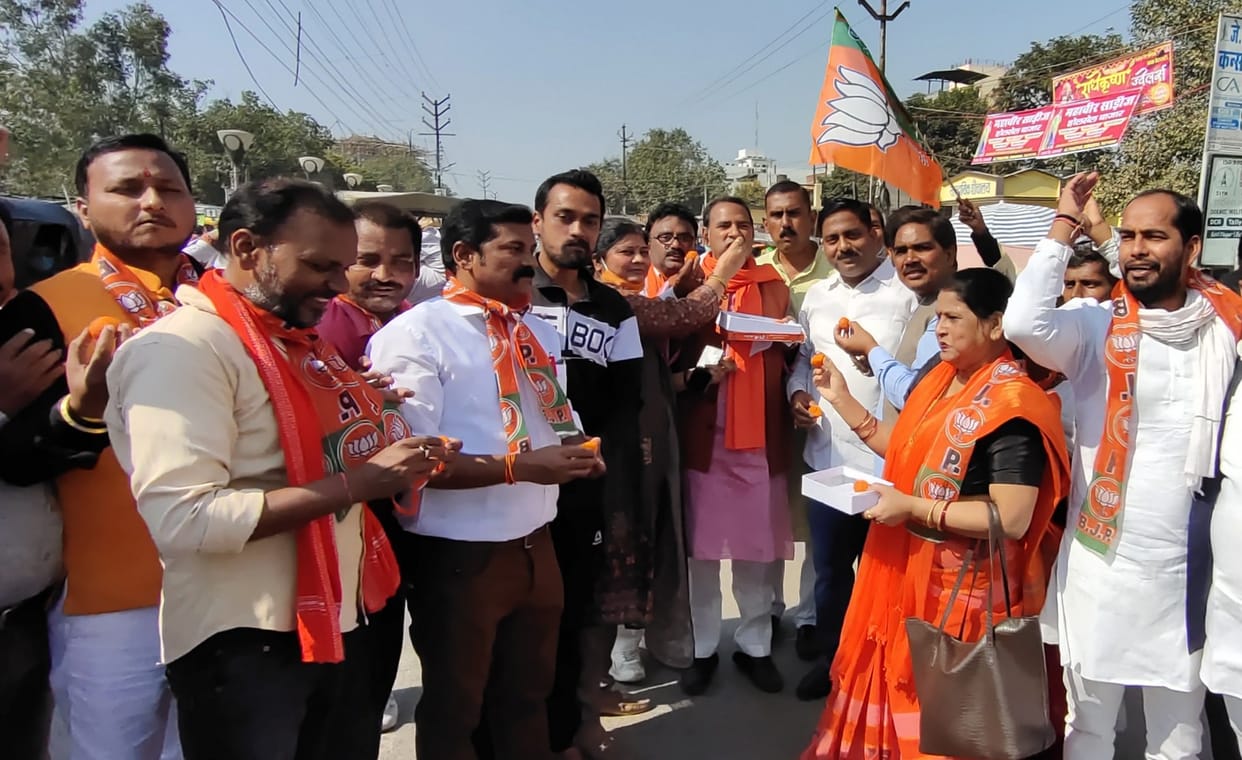 Procession of BJP workers singing and dancing on the beat of drums