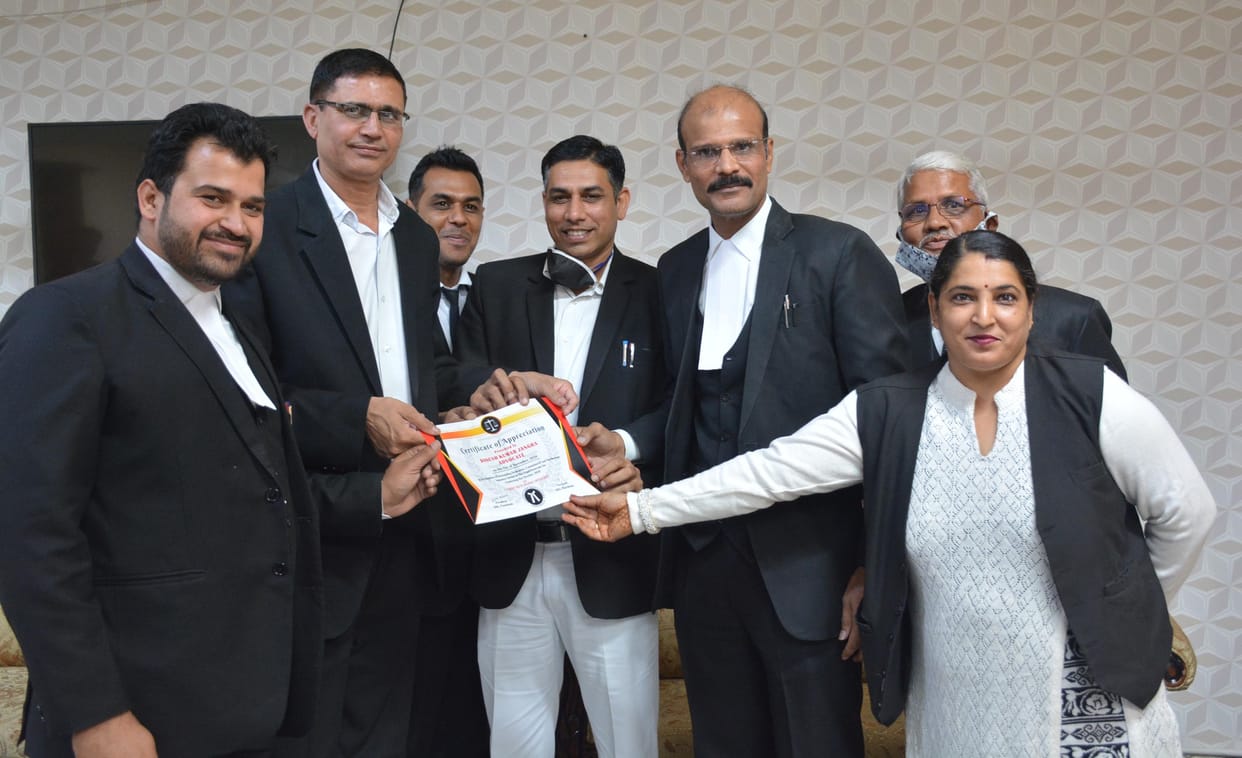 The elected members of the District Bar Association took the oath