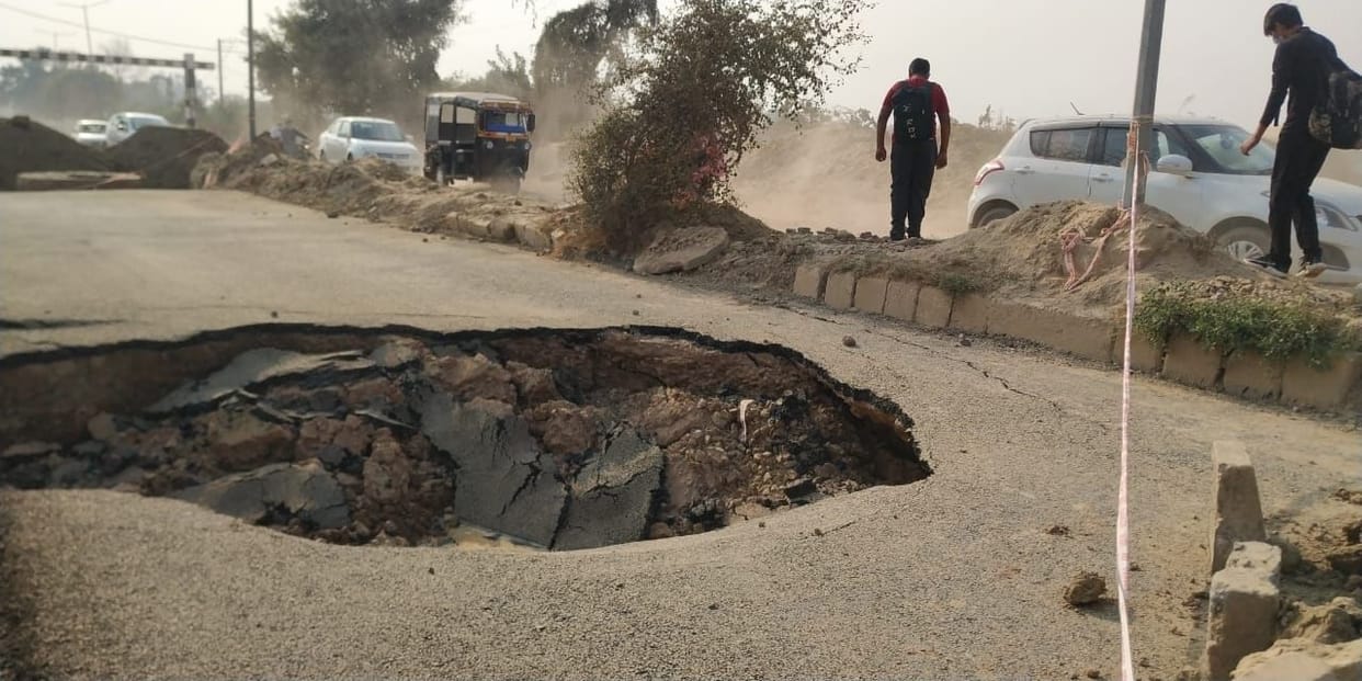 no one department want to take their responcibilty in road hole
