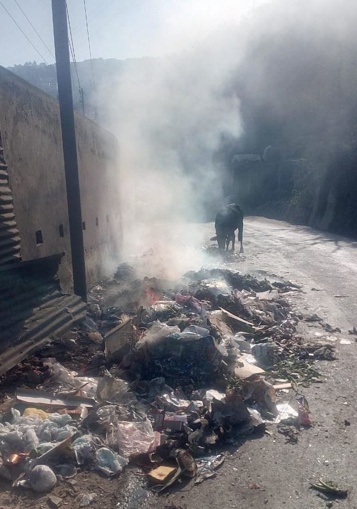 Fire in garbage heap, smoke creates trouble