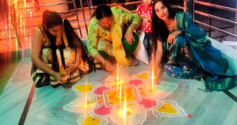 Rangoli made by women, fireworks by children