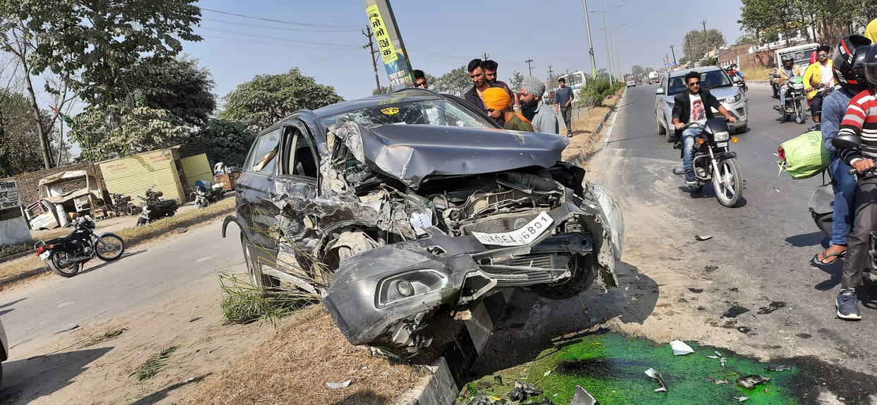 Car Strikes The Divider