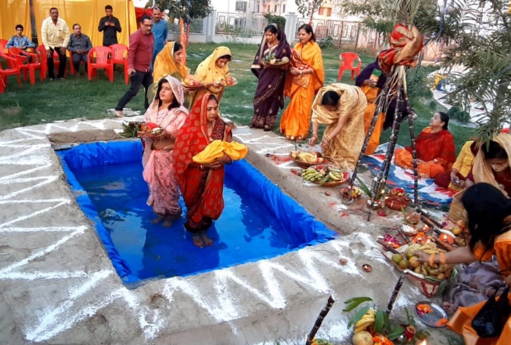 Women offer prayer on Chhath Pooja.
