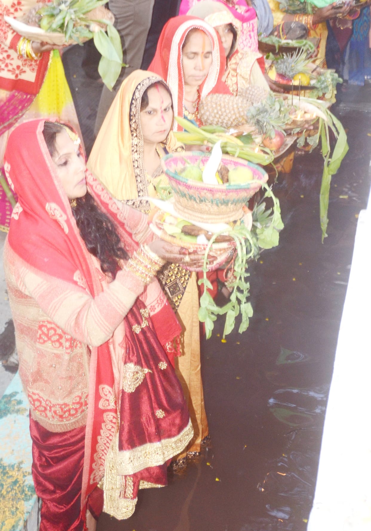 The completion of Chhath Puja by offering arghya to the rising sun