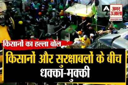 Delhi Police use water cannon & tear gas shells to disperse protesting farmers at Tikri border near Delhi-Bahadurgarh highway.