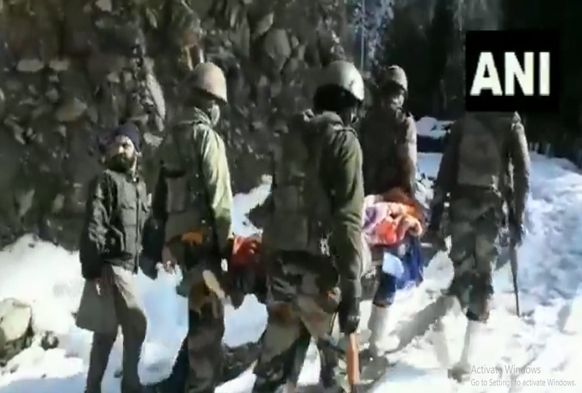 Army soldiers carried a woman, who gave birth to a baby to her home from a govt hospital in Lolab area of Kupwara district