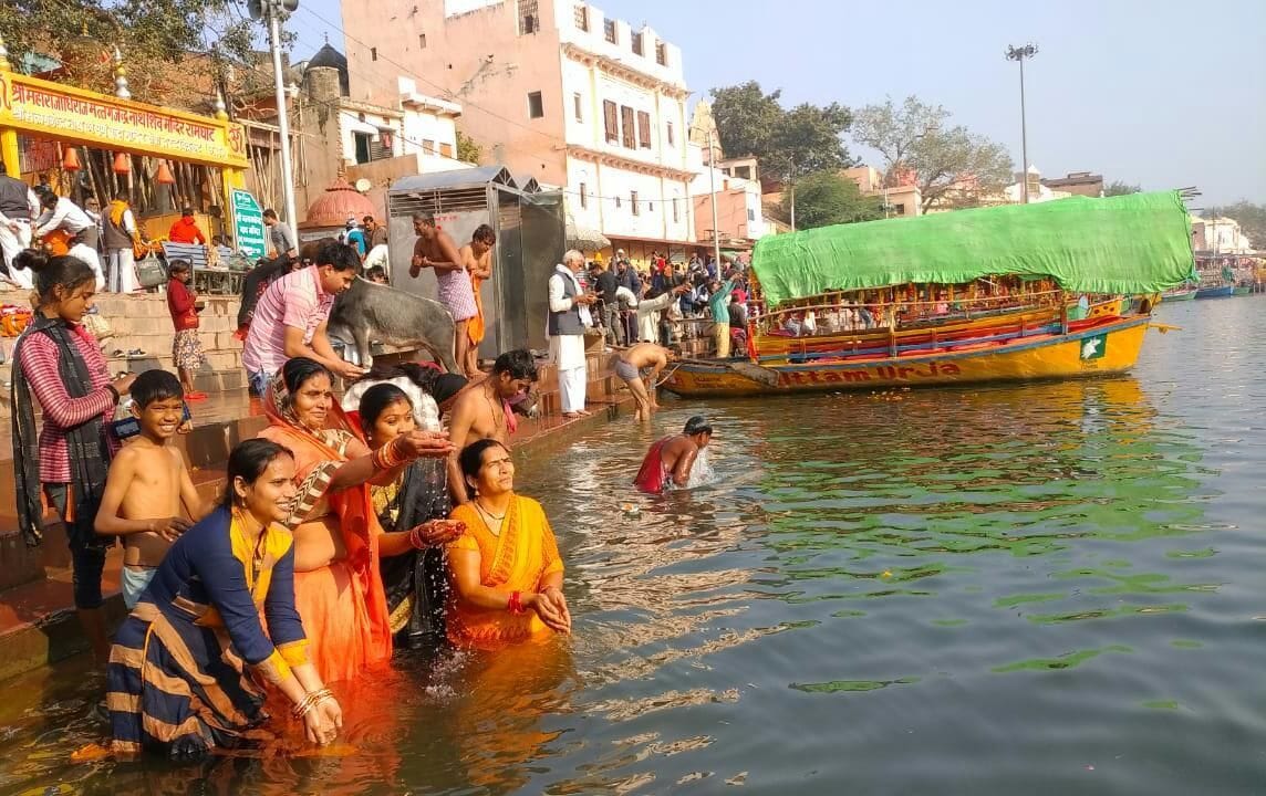 Devotees take a dip in Mandakini on Kartik Purnima