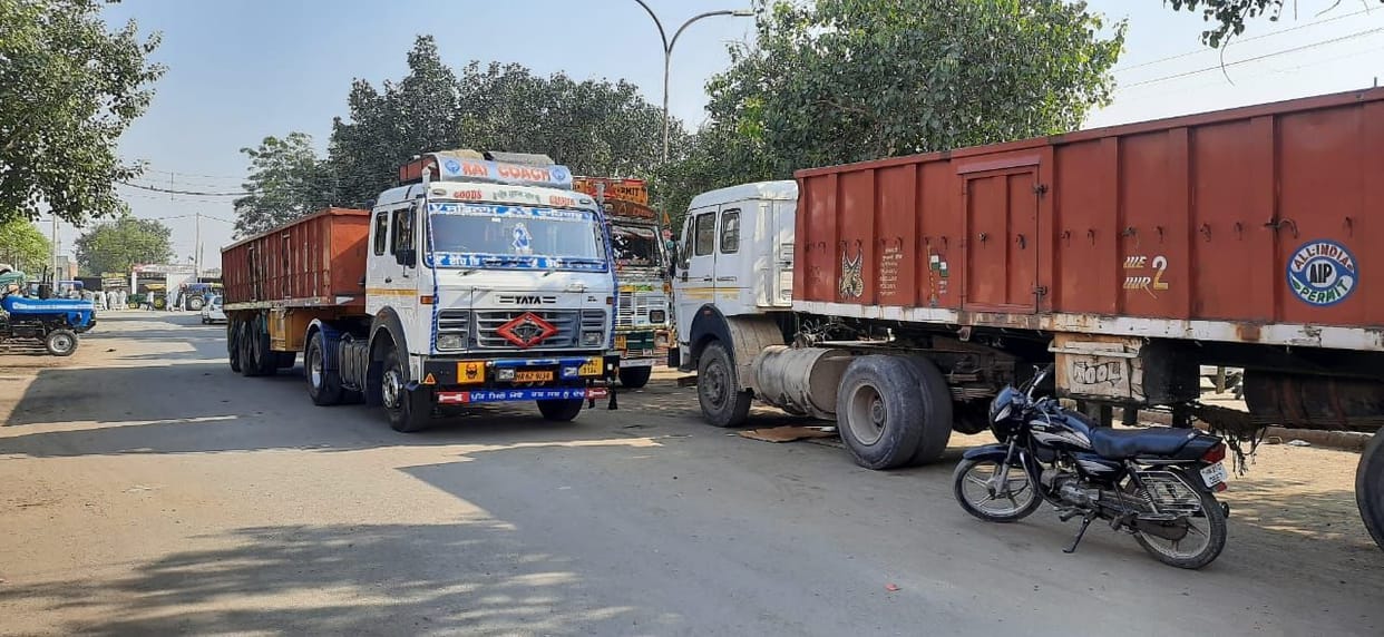 The wheels of 150 trucks stopped