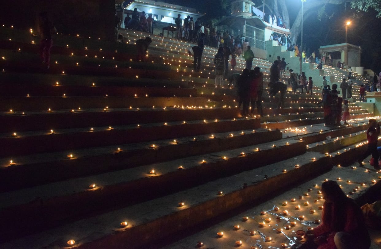 Ghats and temples illuminated by light, echoed
