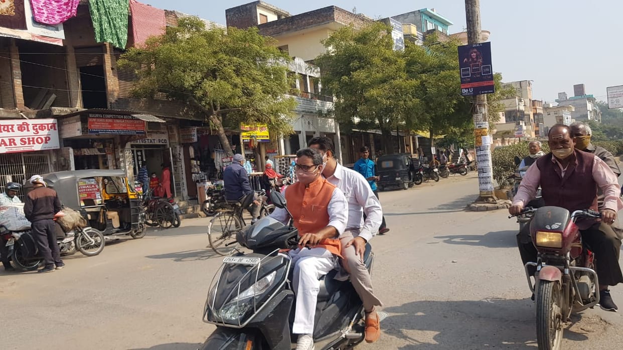 UP Minister Dr Neelkanth Tiwari arrived in Varanasi without helmet on scooty to lay the foundation for interlocking
