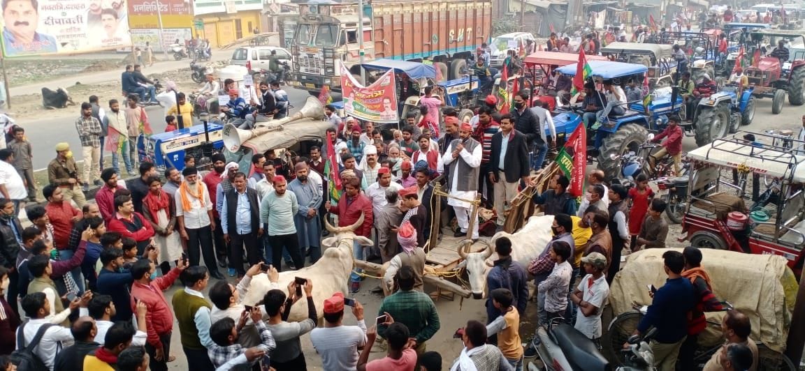 SP workders came on the road carrying bullock cart and tractor