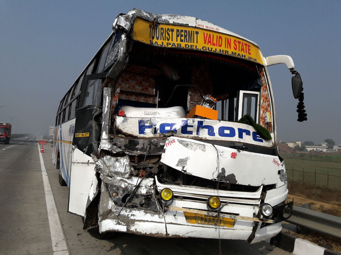 The bus and three cars of devotees collided with the truck parked on EPE