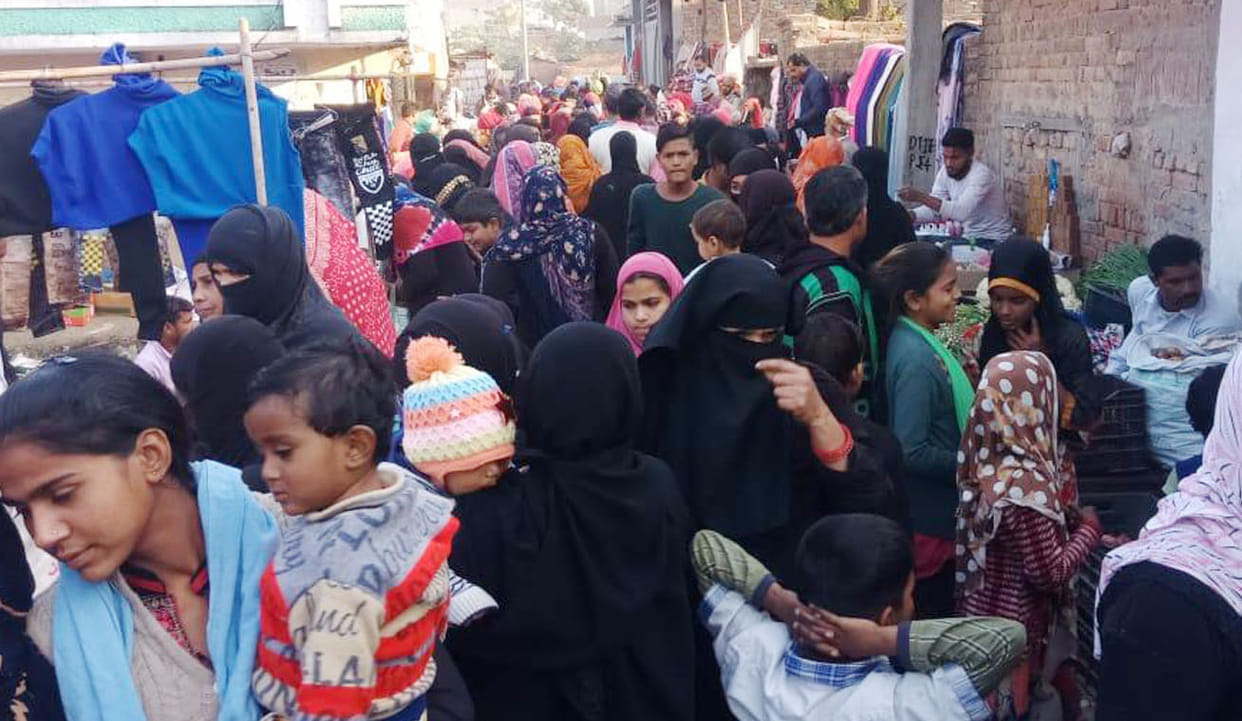 Crowd in the market, neither mask nor social distance