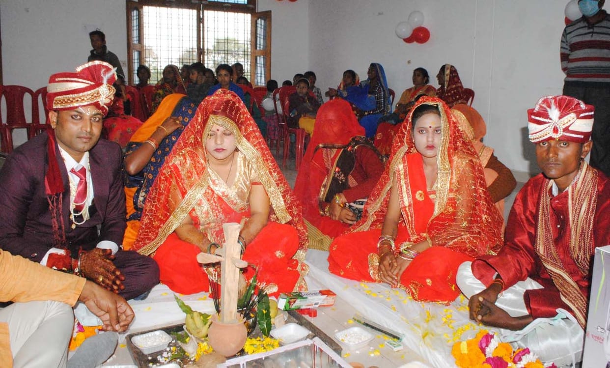 61 couples held each other's hands in mass marriages