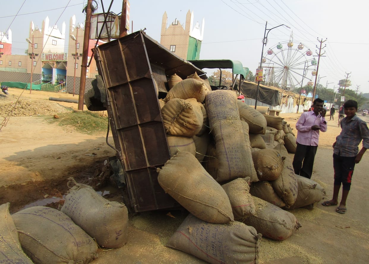 Paddy-laden tractor-trolley overturned after being trapped in pit, narrowly escaped
