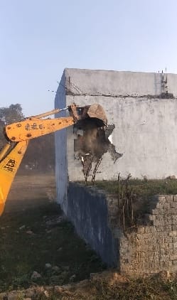 Bulldozer on colony under construction on Bada Bypass