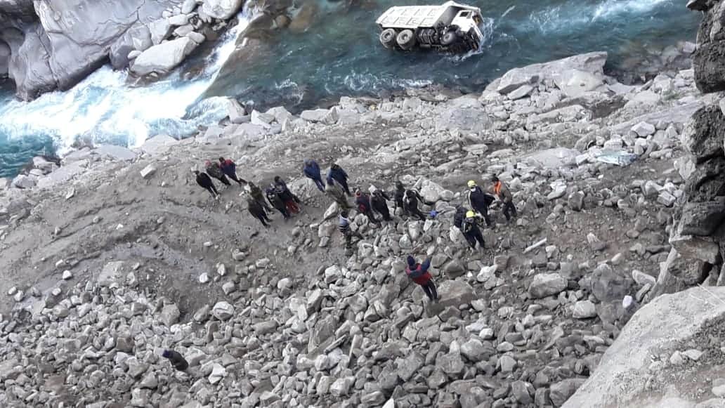 Highway Road Accident News: truck fell into alaknanda river, two missing, ground zero photos
