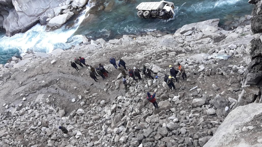 Highway Road Accident News: truck fell into alaknanda river, two missing, ground zero photos
