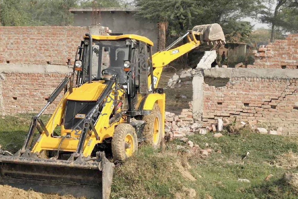 Bahubali MLA Vijay Mishra illegal construction removed by bulldozer from government land in bhadohi