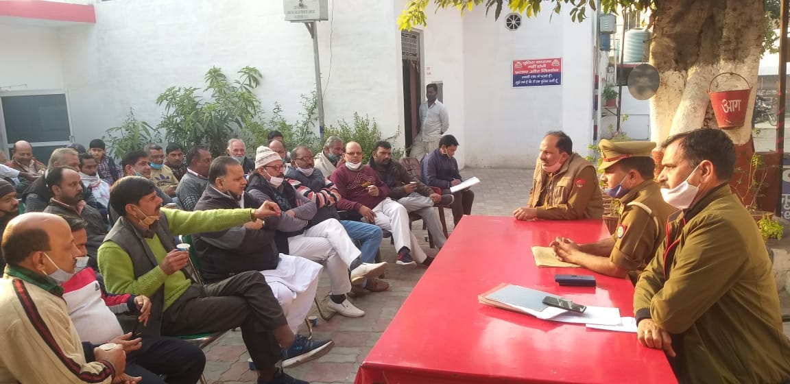 Police station meeting with businessmen
