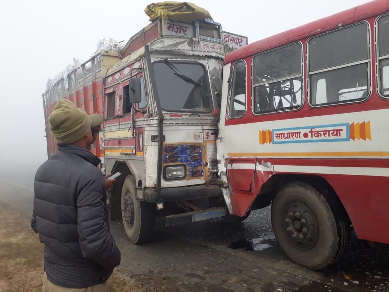 Bus and truck collide in fog, 10 passengers injured