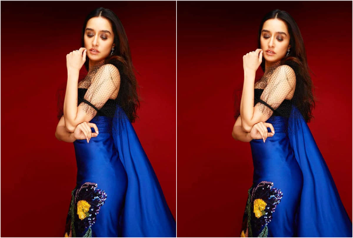 shraddha kapoor make a chic entry at airport in checkered print red jacket with classic blue jeans