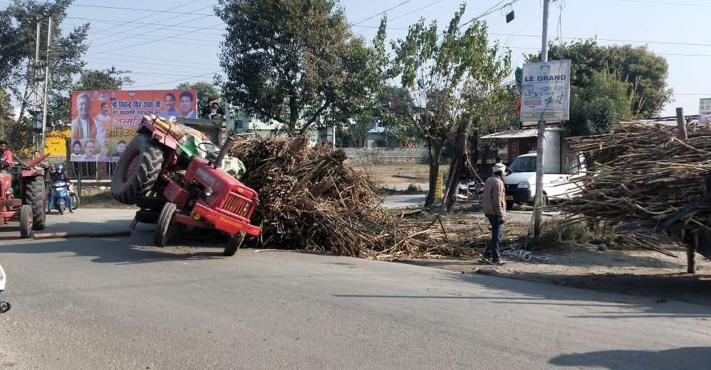 Sugarcane overload tractor trolley overturned