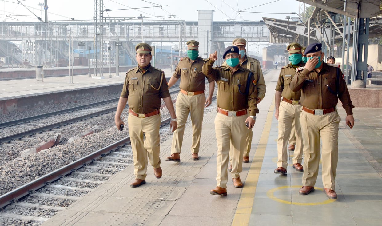criminal watching before crime at sation in vendors uniform