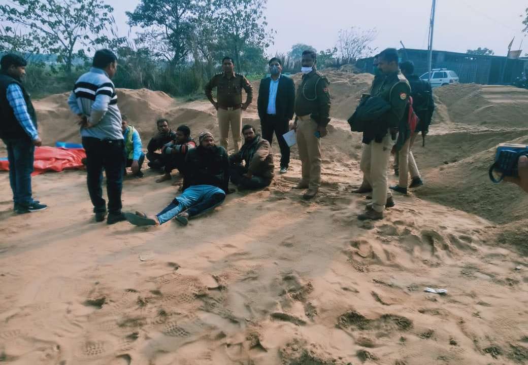 Red sand, sand laden trucks and tractor seas