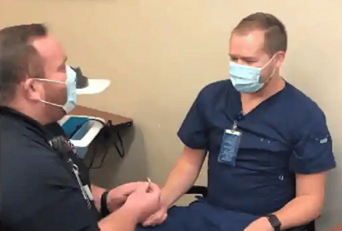 covid 19 vaccine gay couple propose partner for wedding during vaccination