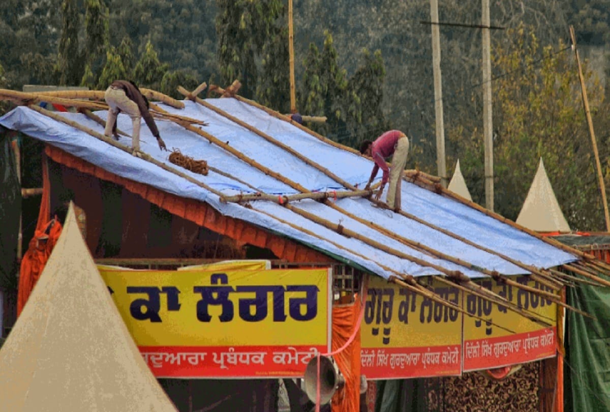 Temporary beds placed on the Singhu border to protect farmers from rain