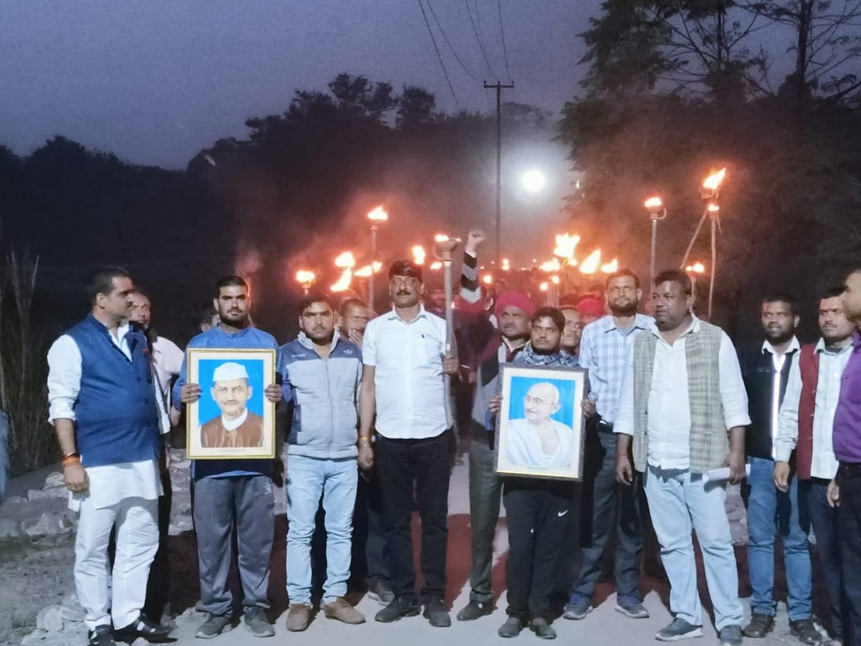 Migrants took out torch procession for employment