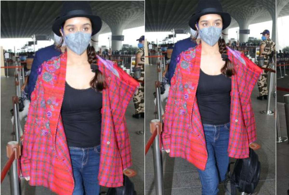 shraddha kapoor make a chic entry at airport in checkered print red jacket with classic blue jeans