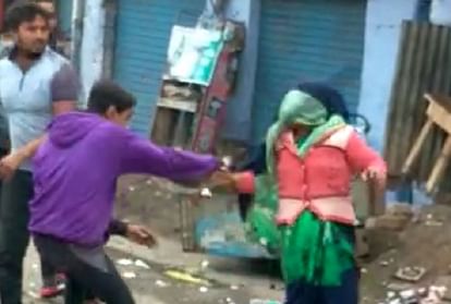 young man beat mother and son with belt in firozabad