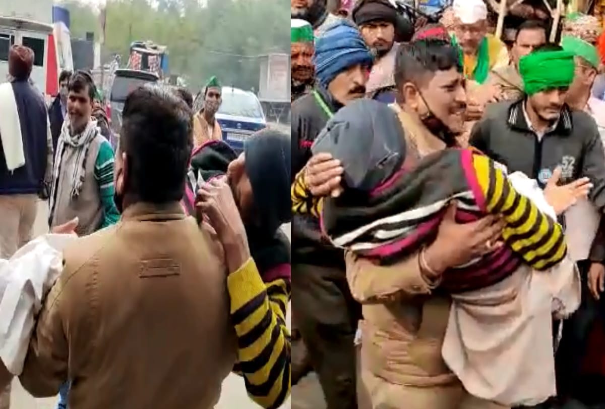 Farmers protest at ghazipur border one kisan gets ill sho kaushambi mahrendra singh carry him in arms to hospital treatment going on all applauding cop gesture