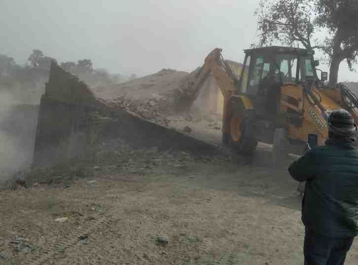 Demolished house on green land