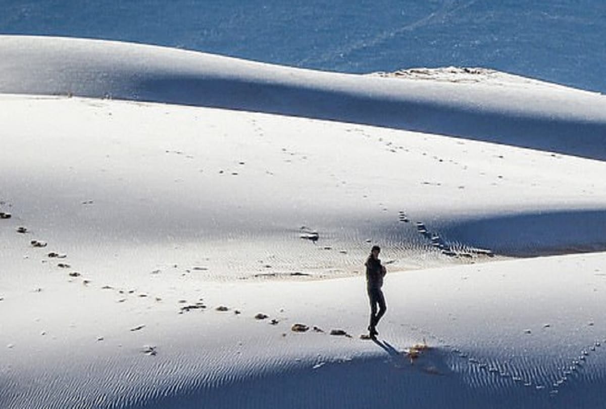 world weather report Ice blankets the Sahara desert while snow falls in Saudi Arabia where temperature has dropped to minus 2C