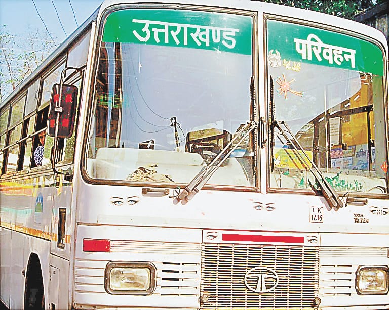 The wheels of three roadways buses stopped