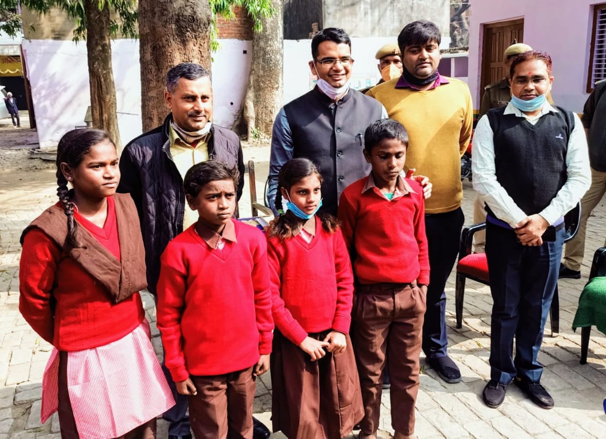 The District Magistrate gave the children shoes and socks on the school
