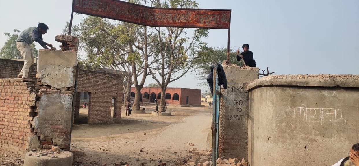 the work of breaking the mail gate of  the school