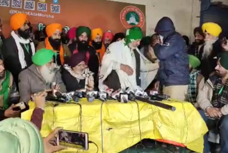 Farmers present a person who alleges a plot to shoot four farmer leaders and cause disruption
