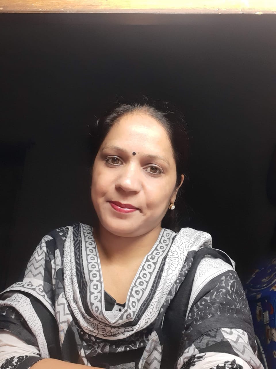 Dr. Pravitra Khatri is smiling in scattered families