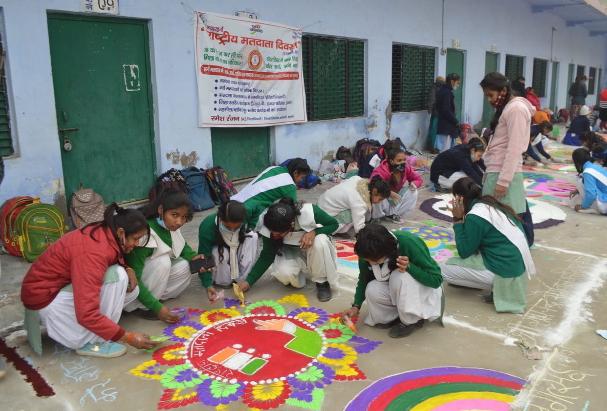 aware about voting by painting and Mehandi competition