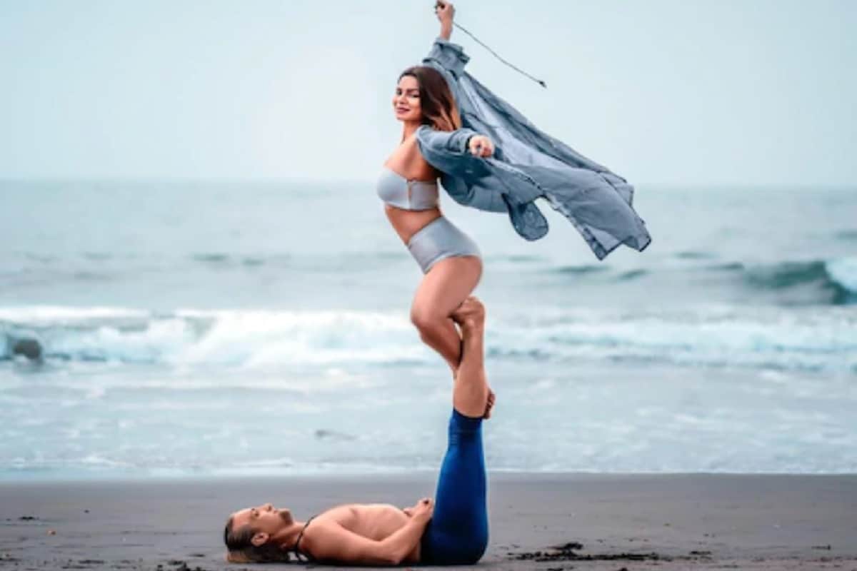 Aashka Goradia Posts Alluring Photos of Her Doing Yoga On The Beach with her husband