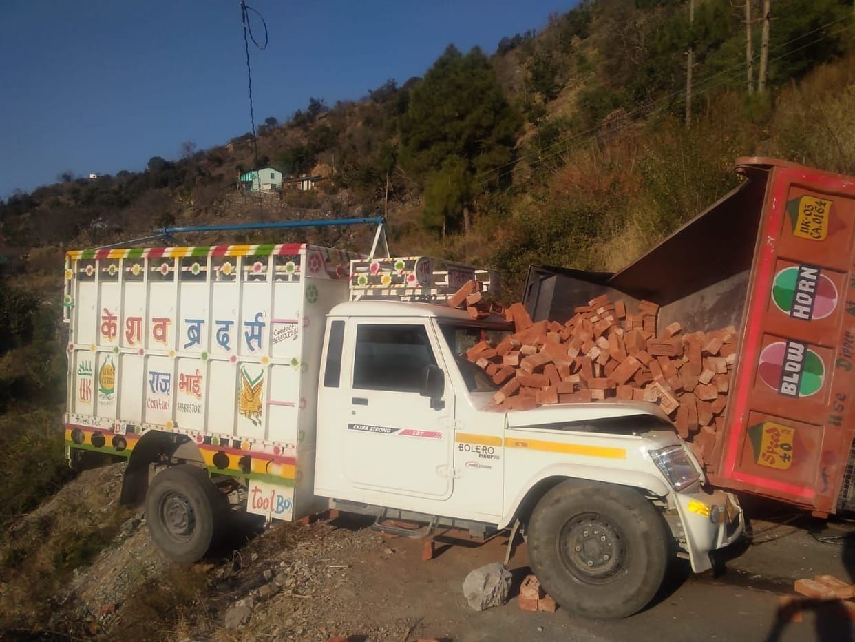 A dumper full of bricks overturned on pickup